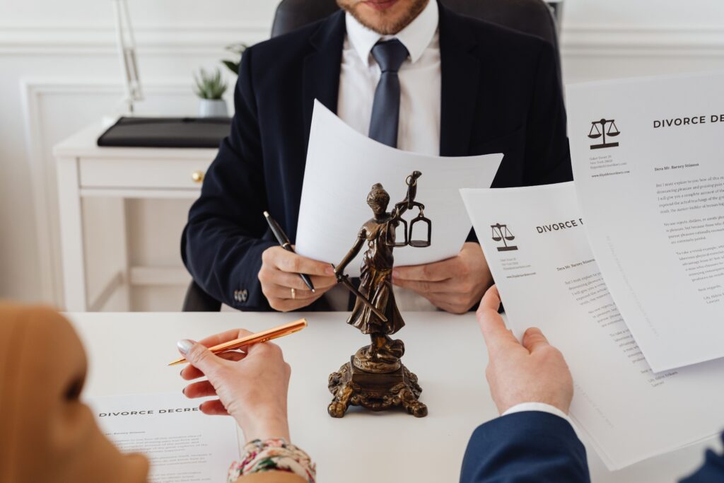 Attorney reviewing legal documents with clients during a record sealing consultation.