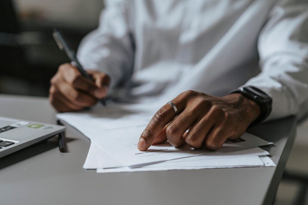 Person reviewing and signing legal paperwork for a Nevada record sealing case.